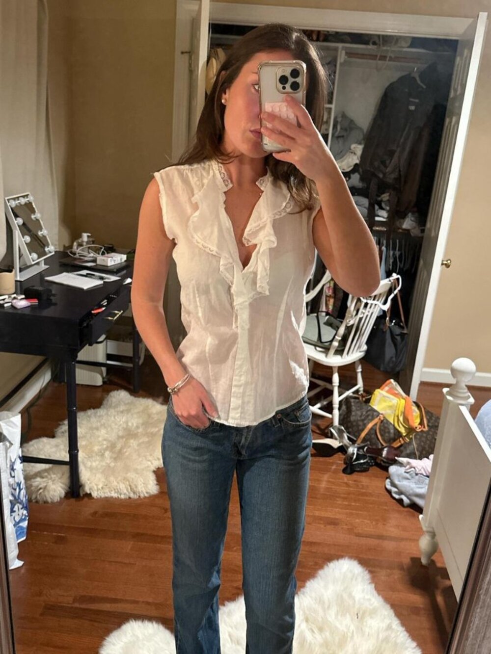 Cream ruffle blouse with a touch of whimsy size small